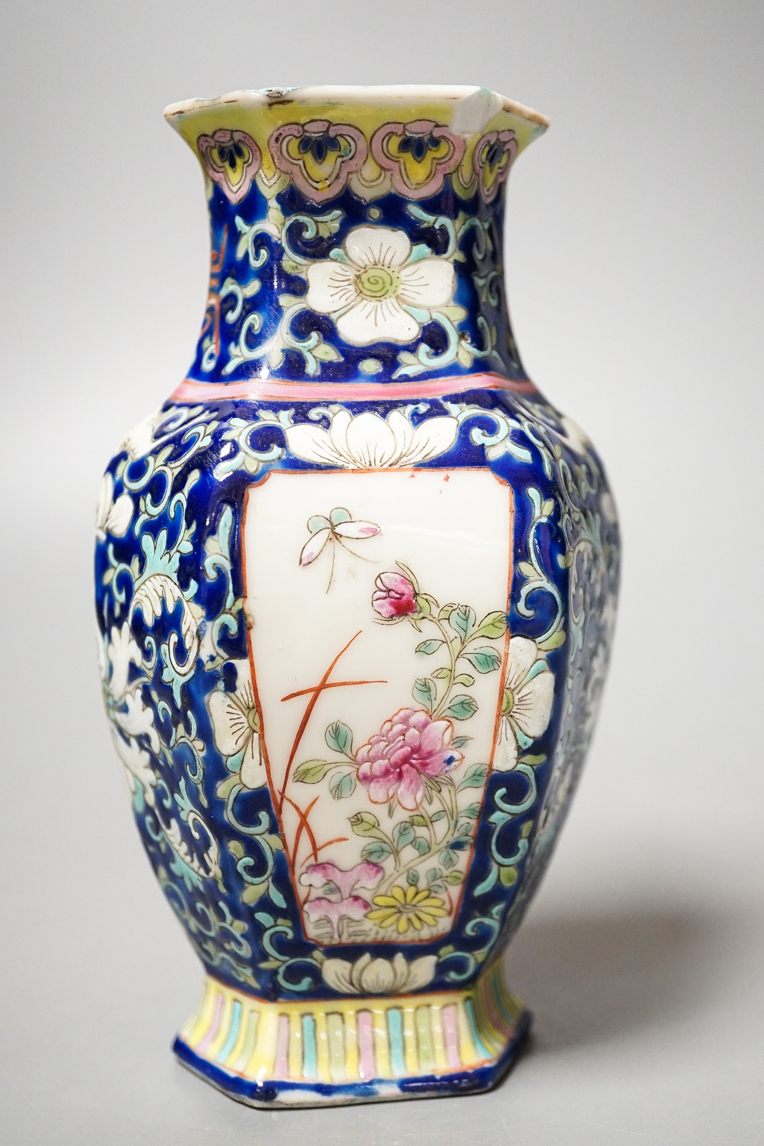 A Chinese blue ground famille rose hexagonal vase, late 19th century, 15cm